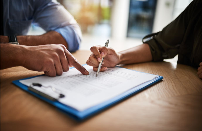 signing insurance paper